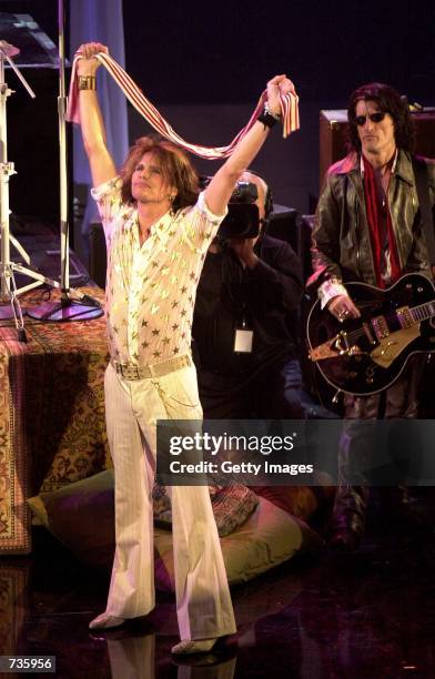 Steven Tyler, left, and Joe Perry of Aerosmith perform during the 28th Annual American Music Awards January 8, 2001 in Los Angeles, CA.