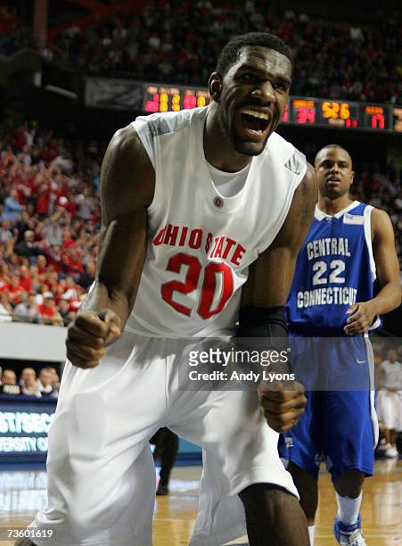 Greg Oden of the Ohio State Buckeyes celebrates as Jemino Sobers of the Central Connecticut State Blue Devils looks on during round one of the NCAA...