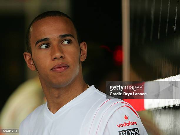 Lewis Hamilton of Great Britain and McLaren Mercedes looks out from his pit garage before the first practice session for the Australian Formula One...
