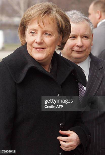 German Chancellor Angela Merkel is met by Polish Prime Minister Jaroslaw Kaczynski as she arrives in Warsaw 16 March 2007. Merkel began a visit to...