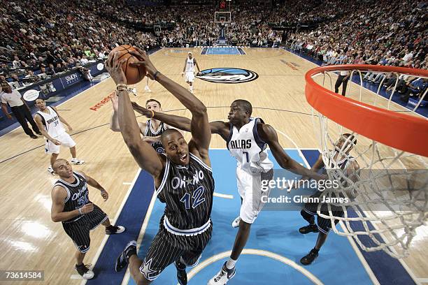 Dwight Howard of the Orlando Magic grabs a rebound past DeSagana Diop of Dallas Mavericks on March 3, 2007 at American Airlines Center in Dallas,...