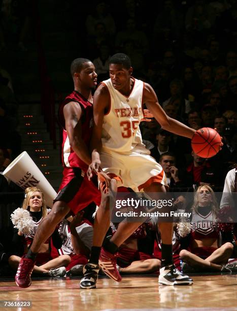 Kevin Durant of the Texas Longhorns posts up David Fisher of the New Mexico State Aggies during the first round of the NCAA Men's Basketball...