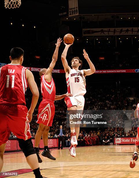 Jorge Garbajosa of the Toronto Raptors takes a shot in the lane against Shane Battier of the Houston Rockets on March 16, 2007 at the Air Canada...