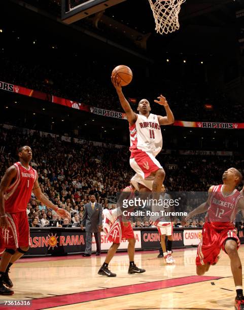Ford of the Toronto Raptors drives to the rim in front of Rafer Alston of the Houston Rockets on March 16, 2007 at the Air Canada Centre in Toronto,...