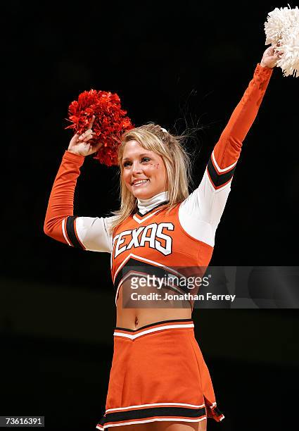 Texas Longhorns cheerleader performs her routine during a break in action against the New Mexico State Aggies during the first round of the NCAA...