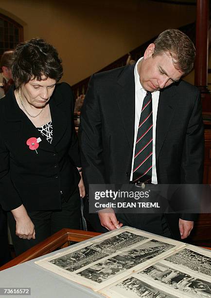 Prince Andrew, The Duke of York and New Zealand Prime Minister Helen Clark inspect a photo album of the New Zealand Maori Battalion at an exhibition...