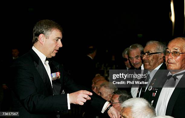 Prince Andrew, Duke of York organises the seating for an official photo at the gala dinner in honour of the members of the 28th Maori Battalion at...