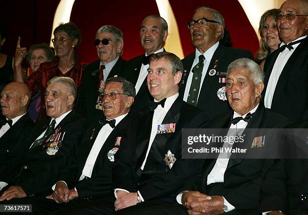 Prince Andrew, Duke of York sits with war veterans for an official photo at the gala dinner in honour of the members of the 28th Maori Battalion at...