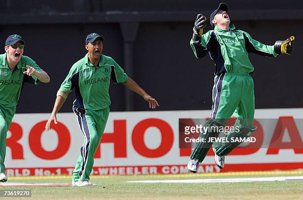 Irish cricketer Niall O'Brien gets airborne in celebration after taking a catch to dismiss Pakistani batsman Younis Khan during their Group D match...