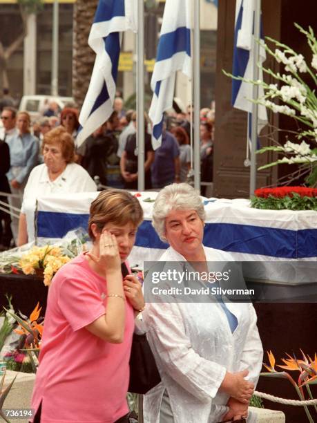 An Israeli woman wipes away her tears as she passes the flag-draped coffin of Leah Rabin, wife of assassinated former Prime Minister Yitzhak Rabin,...