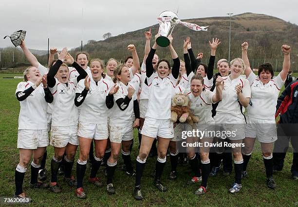 England captain Sue Day, lifts the trophy following her team's 0-30 victory to win the title during the Women's Rugby Union International match...