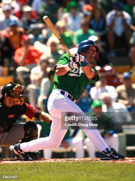 Luis Gonzalez of the Los Angeles Dodgers follows his hit against the Houston Astros during a spring training game on March 17, 2007 at Holman Stadium...
