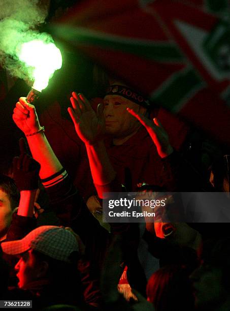 Fans light flares during the Russian Football League Championship match between FC Lokomotiv Moscow and FC Rubin Kazan on March 17, 2007 in Moscow,...