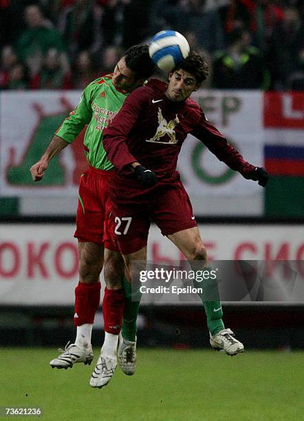 Emir Spahic of FC Lokomotiv Moscow competes for the ball with Veljko Paunovic of FC Rubin Kazan during the Russian Football League Championship match...