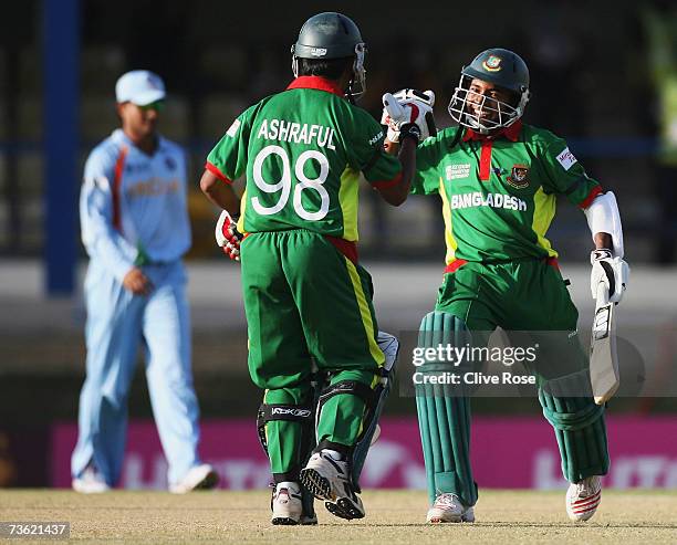 Mushfiqur Rahim and Mohammad Ashraful of Bangladesh celebrate beating India at the end of the ICC Cricket World Cup 2007 Group B match between...