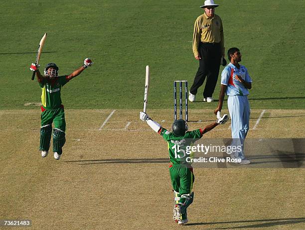 Mushfiqur Rahim and Mohammad Ashraful of Bangladesh celebrate beating India at the end of the ICC Cricket World Cup 2007 Group B match between...