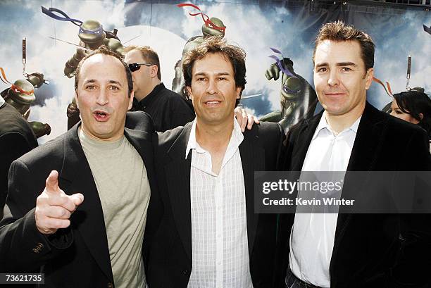 Voice actors Mitchell Whitfield, producer H. Galen Walker, and Nolan North pose at the premiere of Warner Bros. Picture's Teenage Mutant Ninja...