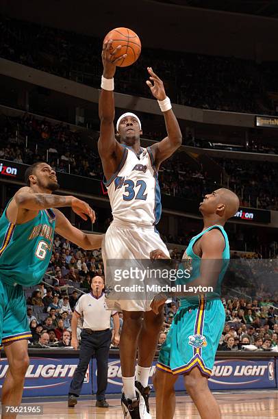 Andray Blatche of the Washington Wizards goes to the basket against Tyson Chandler and Chris Paul of the New Orleans/Oklahoma City Hornets in a NBA...