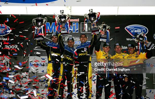 Bryan Herta, Tony Kanaan and Dario Franchitti, drivers of the Andretti Green Racing Acura ARX-01celebrate winning the LMP2 Class with third placed...