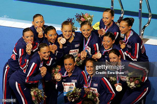 Team United States of America pose with their Bronze medals after the Free Combination Routine Final at the synchronized swimming event during the...