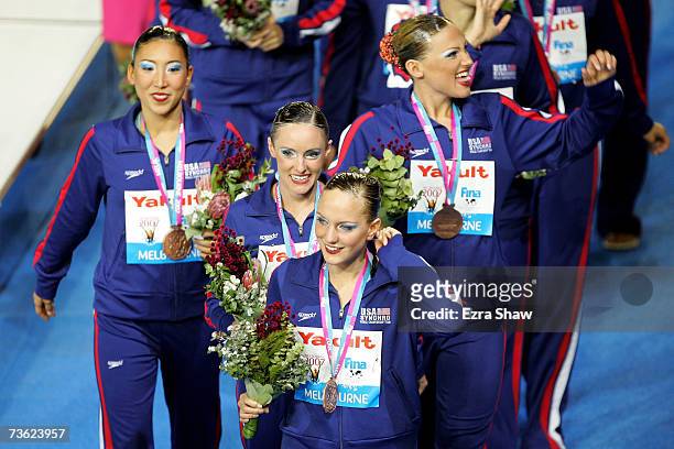 Members of team United States pose with their Bronze medals after the Free Combination Routine Final at the synchronized swimming event during the...