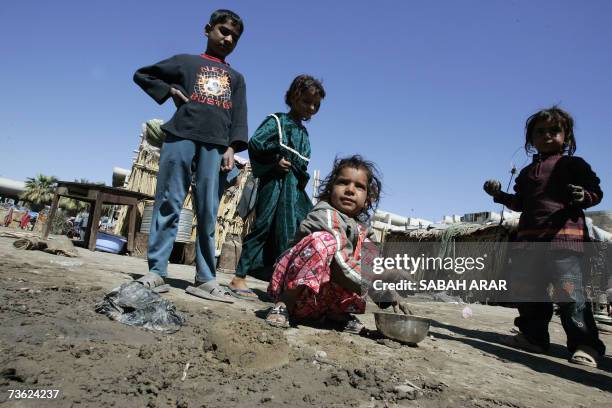 Iraqi homeless children play in an empty field next to makeshift tents built on the abandonned Saddam's Republican Guard Air Force headquarters, in...