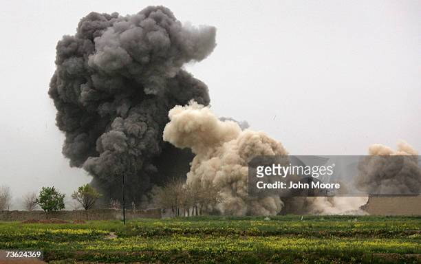 Bomb dropped by a B-1 Bomber explodes on a Taliban position after an air strike was called in during a British commando offensive on March 18, 2007...