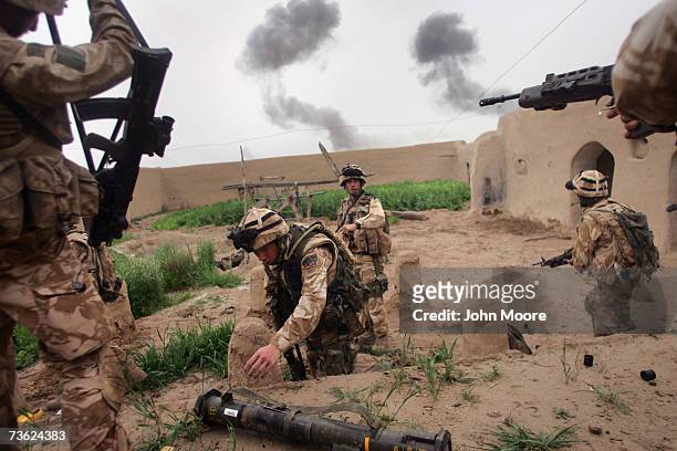British Marines prepare to pull back following an airstrike by B-1 bombers as part of an anti-Taliban operation on March 18, 2007 near Kajaki in the...
