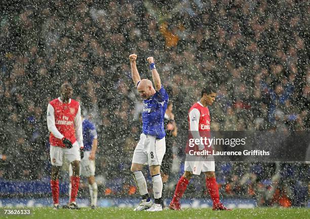 Andy Johnson of Everton celebrates in the hail on the final whistle as Abou Diaby and Denilson of Arsenal look disappointed during the Barclays...