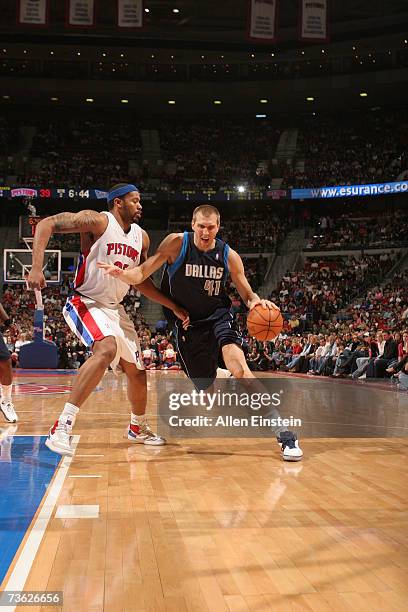 Dirk Nowitzki of the Dallas Mavericks drives around Rasheed Wallace of the Detroit Pistons on March 18, 2007 at the Palace of Auburn Hills in Auburn...