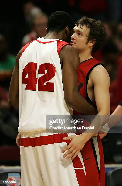 Kevin Kruger of the UNLV Runnin' Rebels is congratulated by Alando Tucker the Wisconsin Badgers during the second round of the NCAA Men's Basketball...