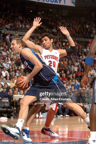 Dirk Nowitzki of the Dallas Mavericks drives past Carlos Delfino of the Detroit Pistons during a game at the Palace of Auburn Hills March 18, 2007 in...