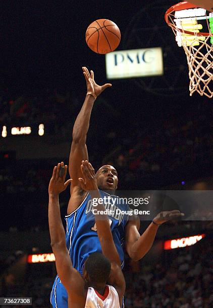 Dwight Howard of the Orlando Magic makes a shot over Eddie Jones of the Miami Heat at American Airlines Arena on March 18, 2007 in Miami, Florida....