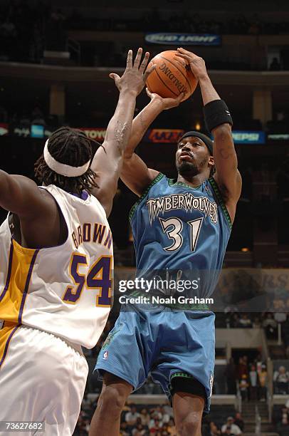 Ricky Davis of the Minnesota Timberwolves puts up a shot against Kwame Brown of the Los Angeles Lakers at Staples Center March 18, 2007 in Los...