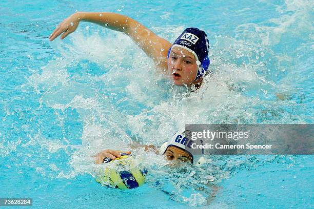 Anna Zubkova of Kazakhstan chases Lioso Kyriaki of Greece in the Women's Preliminary Round Group C Water Polo match between Greece and Kazakhstan at...