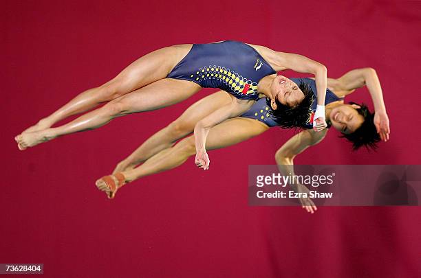 Tong Jia and Ruolin Chen of China compete in the Women's 10m Synchronised Platform preliminary event during the XII FINA World Championships on March...