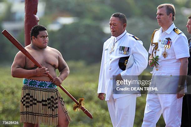 Auckland, NEW ZEALAND: Prince Andrew , of Britain walks past a maori warrior as he is escorted by warrant officer Mark Pirikahu during a visit to Te...