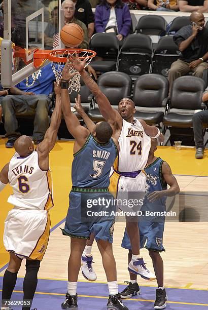 Kobe Bryant of the Los Angeles Lakers goes up to block a shot against Craig Smith of the Minnesota Timberwolves on March 18, 2007 at Staples Center...