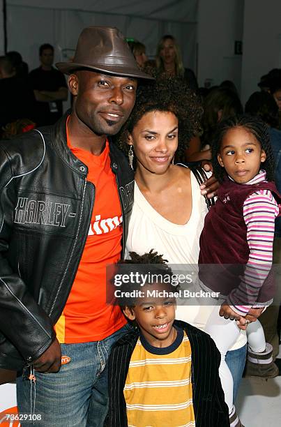 Actor Jimmy Jean-Louis, son Thevi, wife Evelyn and daughter Jasmine pose in the front row at the Voom by Joy Han Fall 2007 fashion show during...