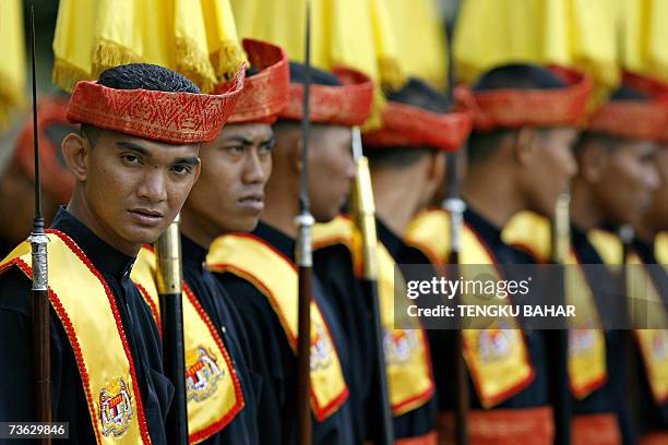 Kuala Lumpur, MALAYSIA: A Royal Court guard stands at ease prior to the arrival of the King of Malaysia Tuanku Mizan Zainal Abidin at the Parliament...