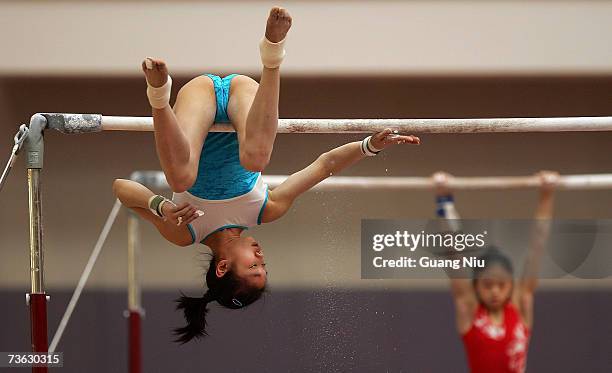 Chinese gymnasts practise during a training session of the national team on March 17, 2007 in Beijing, China. Chinese gymnasts are training hard for...