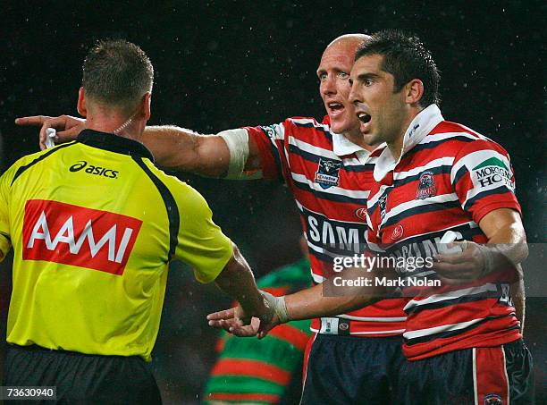 Craig Fitzgibbon and Braith Anasta dispute a decision during the round one NRL match between the Sydney Roosters and the South Sydney Rabbitohs at...