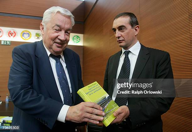 Author Horst Hilpert of the DFB sports court and Michael Schremmer, publisher of De Gruyter Rechtswissenschaften Verlag present Hilpert's book...