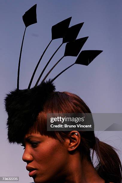 Model wears millinery down the catwalk at Swatch Alternative Fashion Week on March 19, 2007 in London, England. The Swatch Alternative Fashion week...