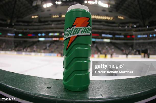 Gatorade water bottle sits on the boards at the bench during the NHL game between the Columbus Blue Jackets and the Dallas Stars during their NHL...