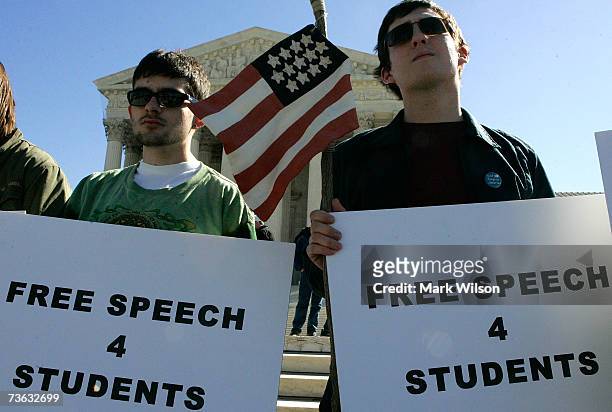 University of Maryland student Jay Hartman holds a flag while protesting with the group "Sensible Drug Policy" during a rally in front of the U.S....