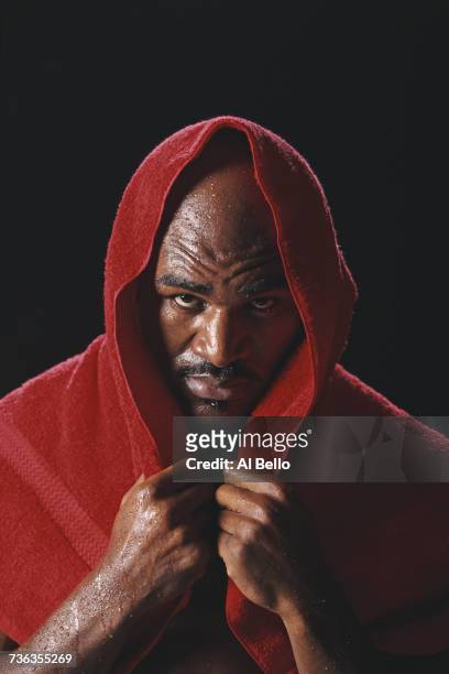 And WBA World Heavyweight Boxing Champion Evander Holyfield of the United States poses for a portrait on 29 December 1997 in Atlanta, Georgia, United...