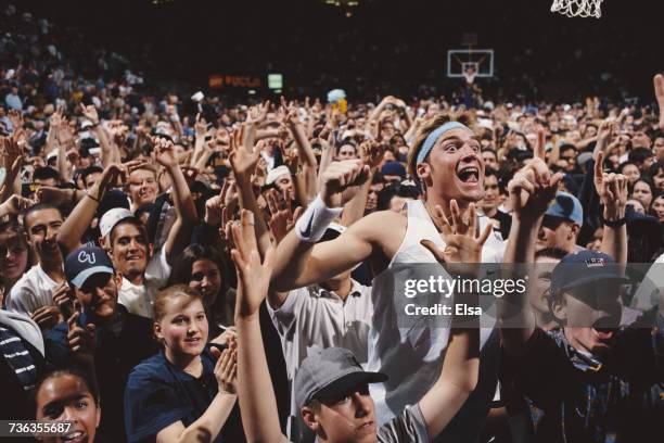 Bruins fans enthusiastically celebrate a 74-67 win over the Oregon State Beavers to win the NCAA Pac-10 college basketball championship title on 1...