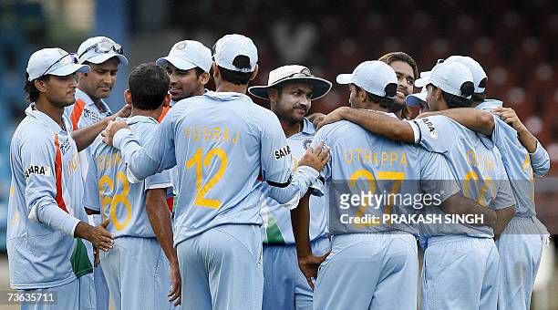 Port-of-Spain, TRINIDAD AND TOBAGO: The Indian cricket team celebrate the wicket of Bermuda cricketer Dean Minors during their Group B World Cup...