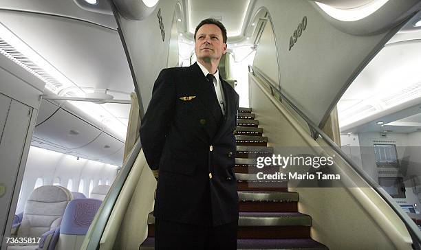 Lufthansa pilot Wolfgang Absmeier stands in the stairwell of the new Airbus A380, a double-decker plane flown by Lufthansa, after it arrived at JFK...